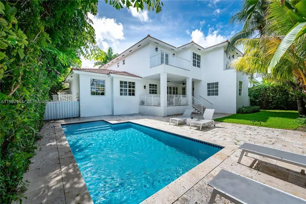 a front view of house with yard and outdoor seating