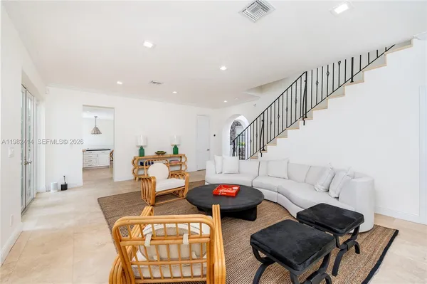 a living room with furniture and a table