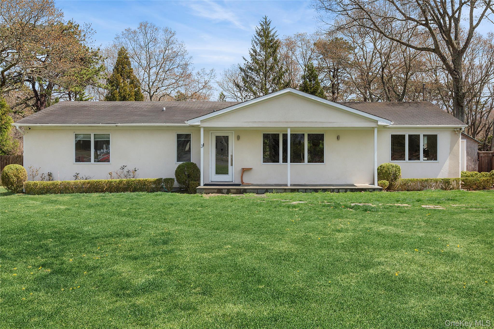 3 Jones Road Hampton Bays, NY 11946 - Photo 1 of 19 a front view of house with yard and green space