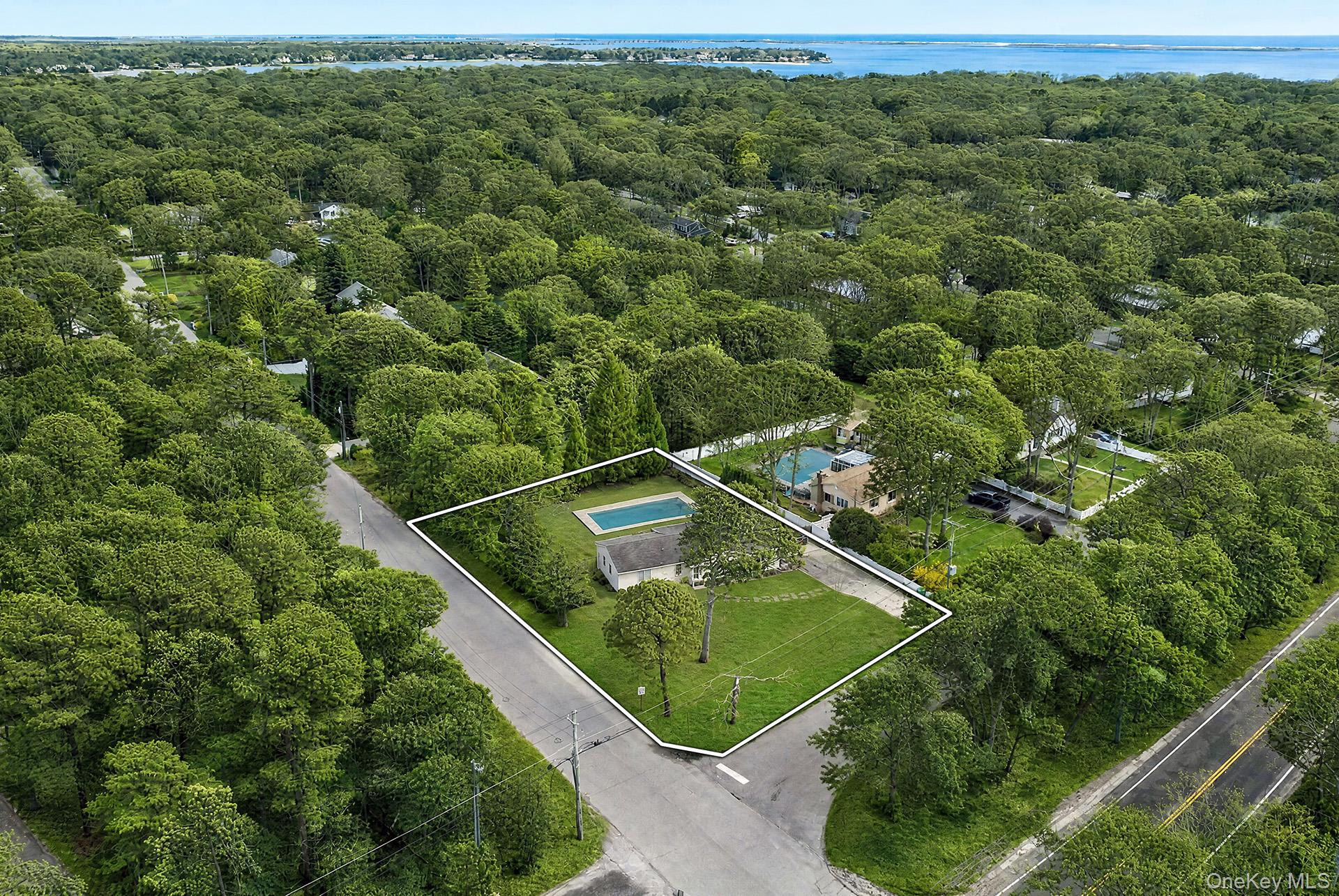 3 Jones Road Hampton Bays, NY 11946 - Photo 18 of 19 an aerial view of a residential houses with outdoor space and trees