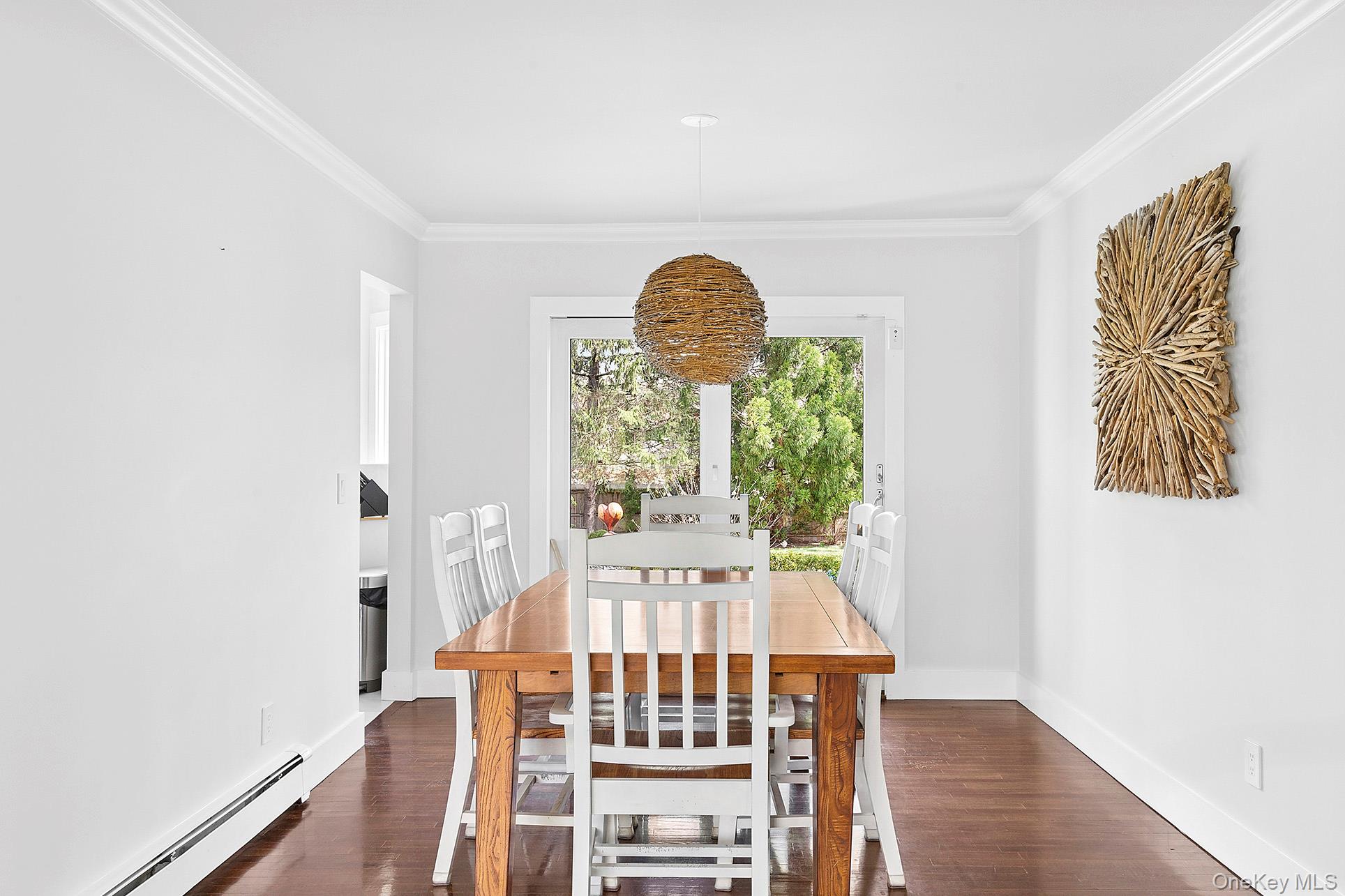 3 Jones Road Hampton Bays, NY 11946 - Photo 6 of 19 a view of a dining room with furniture window and wooden floor