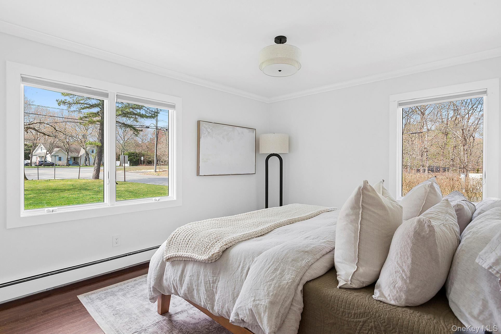 3 Jones Road Hampton Bays, NY 11946 - Photo 9 of 19 a bedroom with a bed and a window