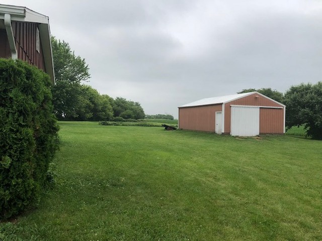 1348 Eldena Road Dixon, IL 61021 - Photo 19 of 20 a backyard of a house with plants and large trees