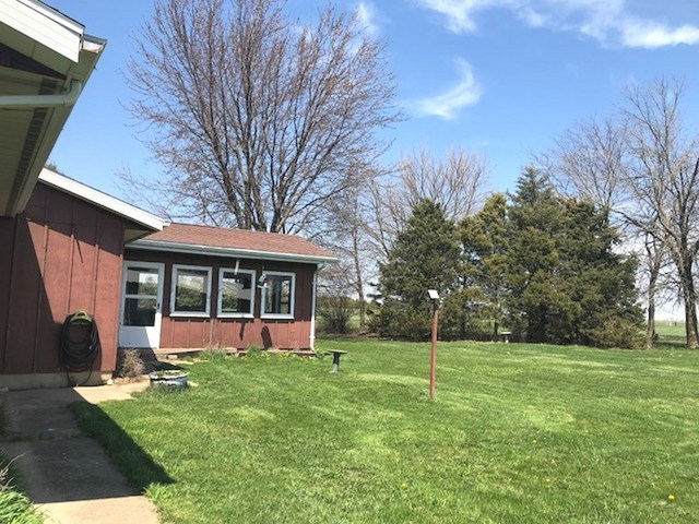 1348 Eldena Road Dixon, IL 61021 - Photo 7 of 20 a view of a house with backyard and a tree