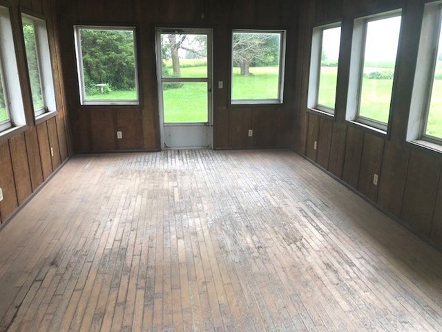 1348 Eldena Road Dixon, IL 61021 - Photo 10 of 20 an empty room with wooden floor and windows