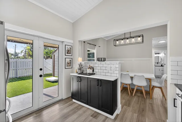 a kitchen with a table and chairs