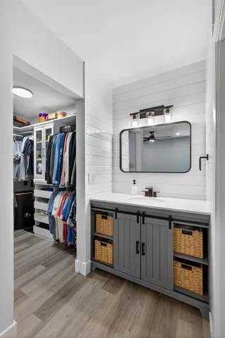 a kitchen with a sink and cabinets