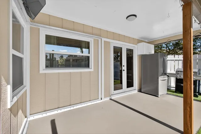 a view of a hallway with windows