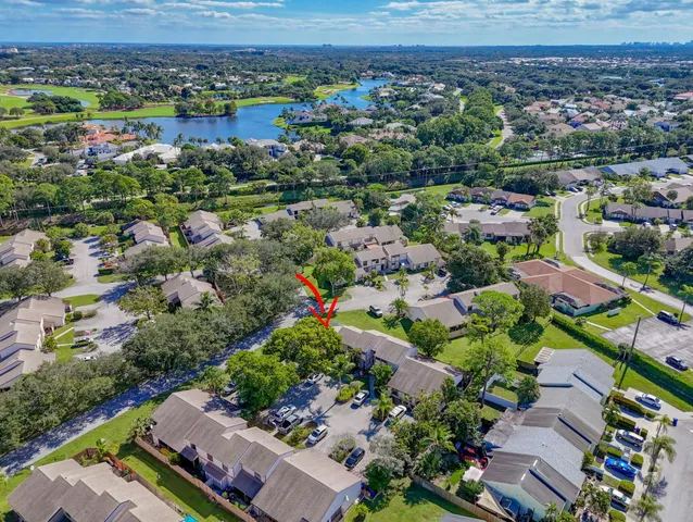 an aerial view of a houses with a swimming pool