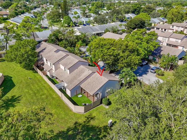 an aerial view of a house with a garden