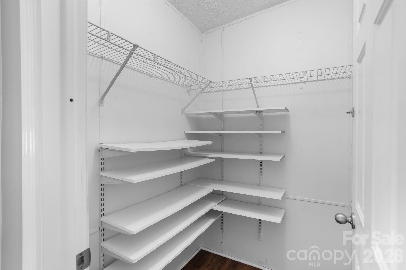 4855 Talley Road Walkertown, NC 27051 - Photo 25 of 45 a view of walk in closet with empty racks