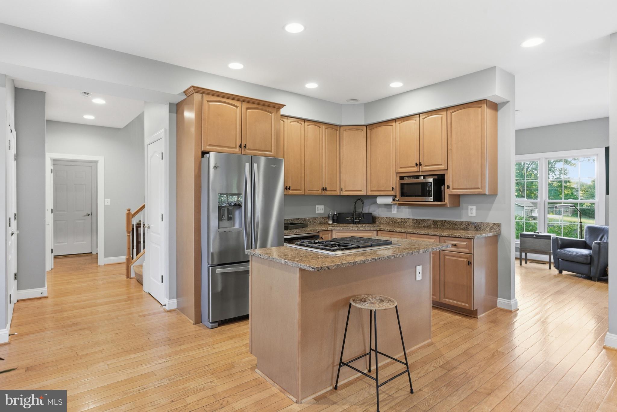 1219 Meadow View Road Pasadena, MD 21122 - Photo 15 of 70 Modern kitchen with warm wood tones.