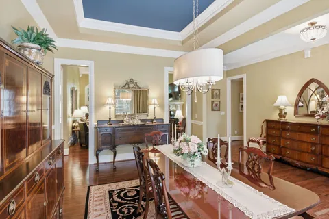 a view of a livingroom with furniture hardwood floor and a window