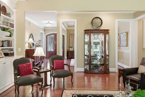 a kitchen with kitchen island a sink stove and cabinets