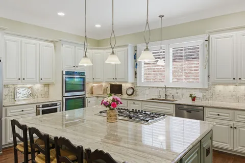 a kitchen with a sink and a window