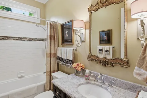 a bedroom with a bed and a table in it