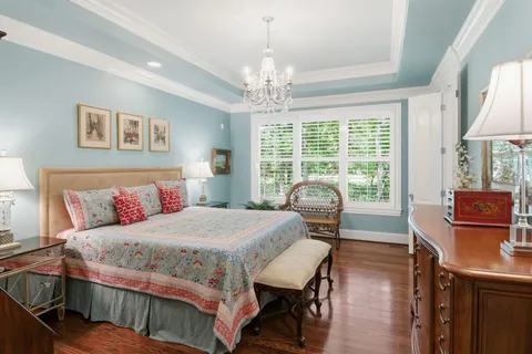 a living room with furniture chandelier and a chandelier
