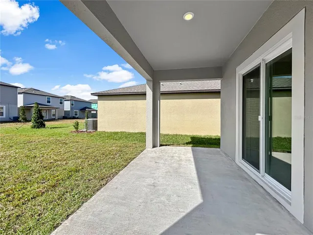 a view of a porch with a big yard