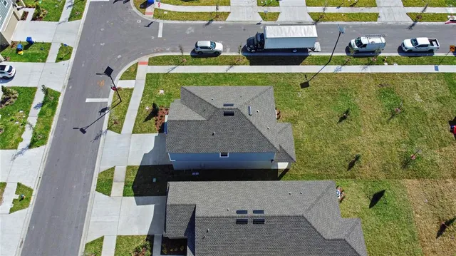 an aerial view of a house with a garden
