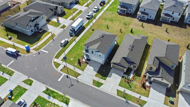 an aerial view of a building with garden