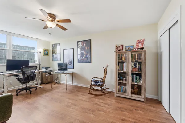 a living room with furniture workspace and a window