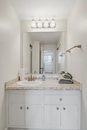 a bathroom with a shower a toilet and a shower