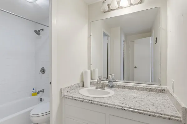 a bathroom with a bathtub and toilet