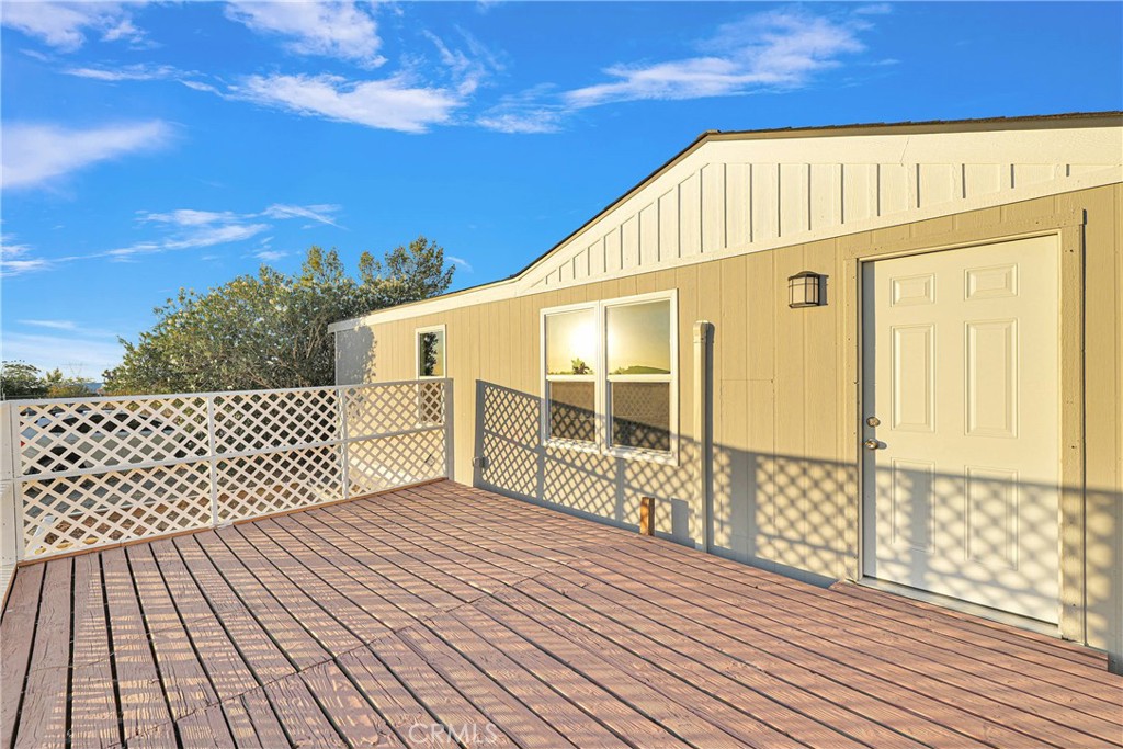 13135 Evergreen Road Pinon Hills, CA 92372 - Photo 1 of 1 a view of a wooden balcony with wooden floor