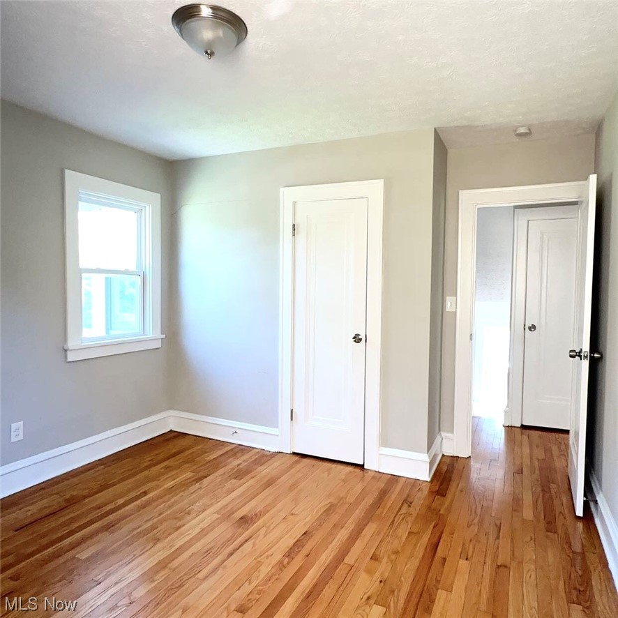 1055 Hillstone Road Cleveland Heights, OH 44121 - Photo 6 of 16 View of wood floored empty room