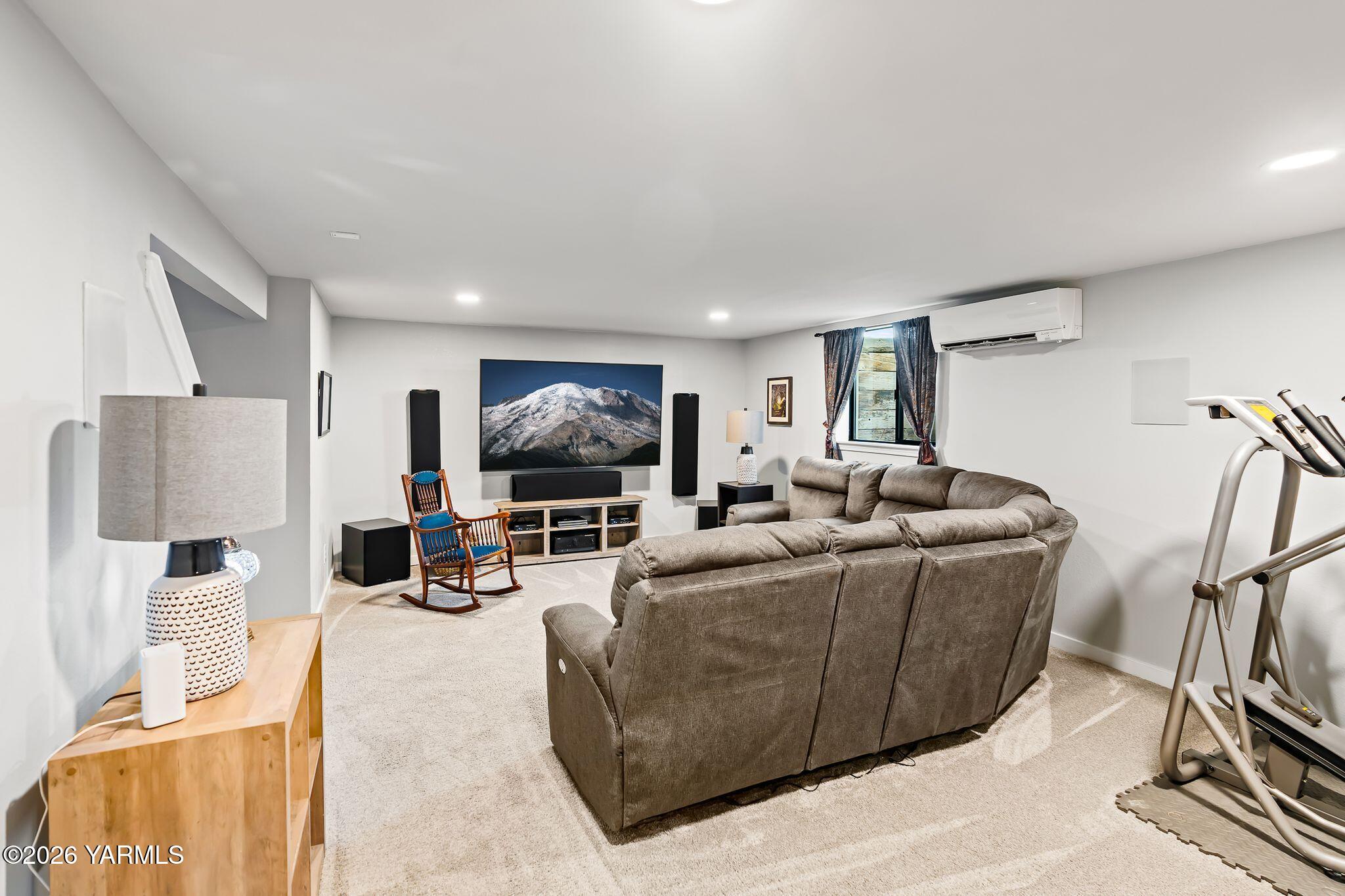 2550 Kays Road Wapato, WA 98951 - Photo 30 of 52 a living room with furniture a flat screen tv and a large window