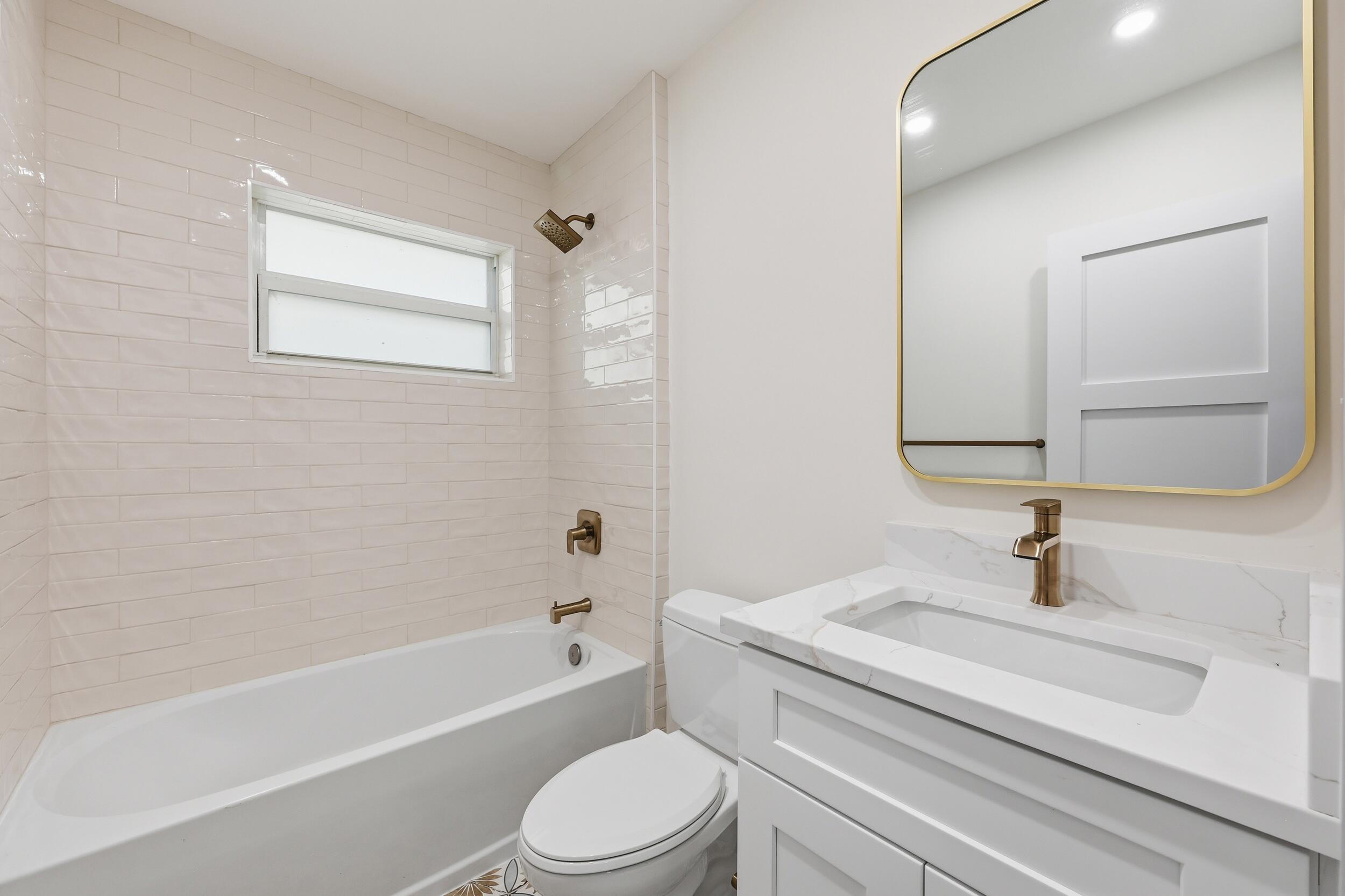 403 Todd Street Jupiter, FL 33458 - Photo 23 of 30 a bathroom with a sink a toilet and shower