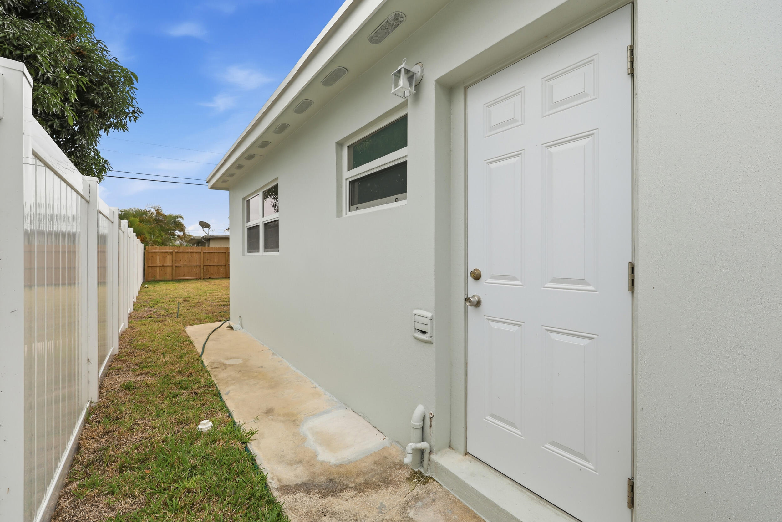 403 Todd Street Jupiter, FL 33458 - Photo 25 of 30 a bathroom with a sink and mirror