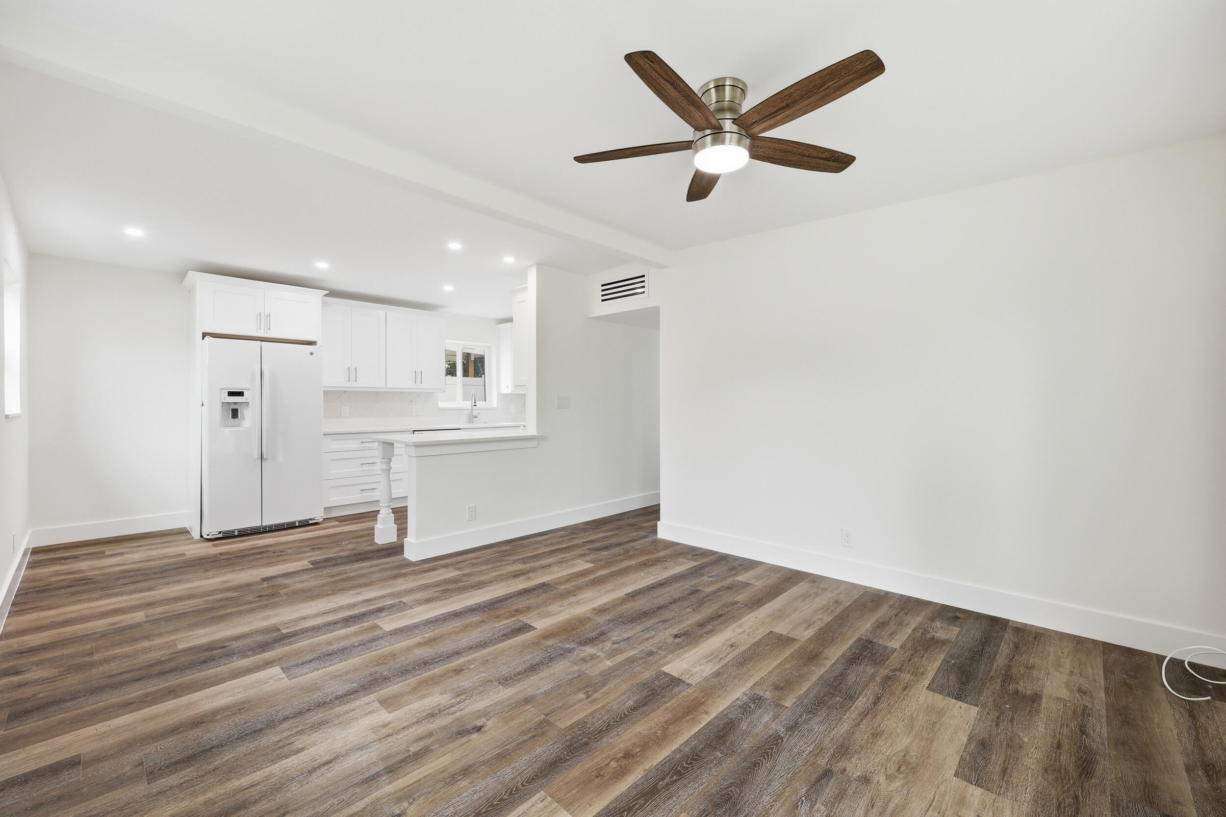 403 Todd Street Jupiter, FL 33458 - Photo 8 of 30 a view of empty room with wooden floor and window