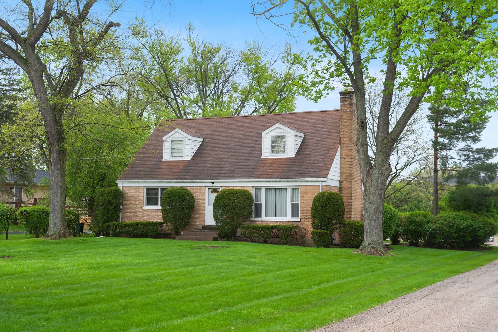 1450 Sanders Road Northbrook, IL 60062 - Photo 2 of 8 front view of a house with a yard