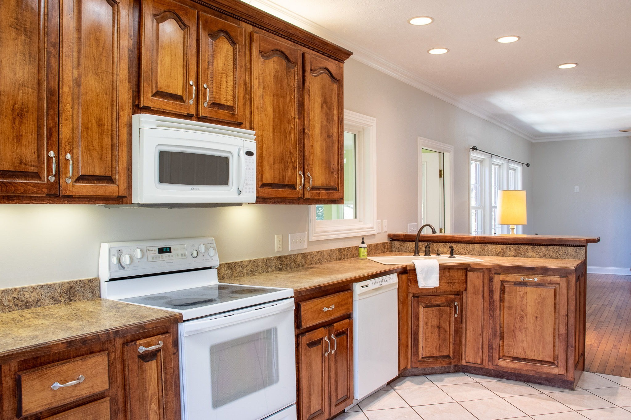 1623 Friendship Road Cross Plains, TN 37049 - Photo 20 of 56 a kitchen with stainless steel appliances granite countertop a stove a sink and a microwave