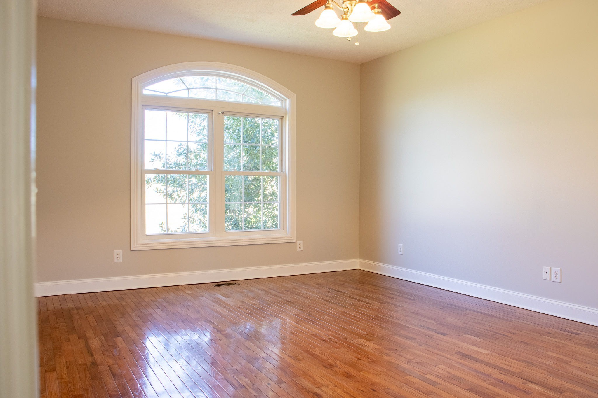 1623 Friendship Road Cross Plains, TN 37049 - Photo 24 of 56 an empty room with wooden floor and windows