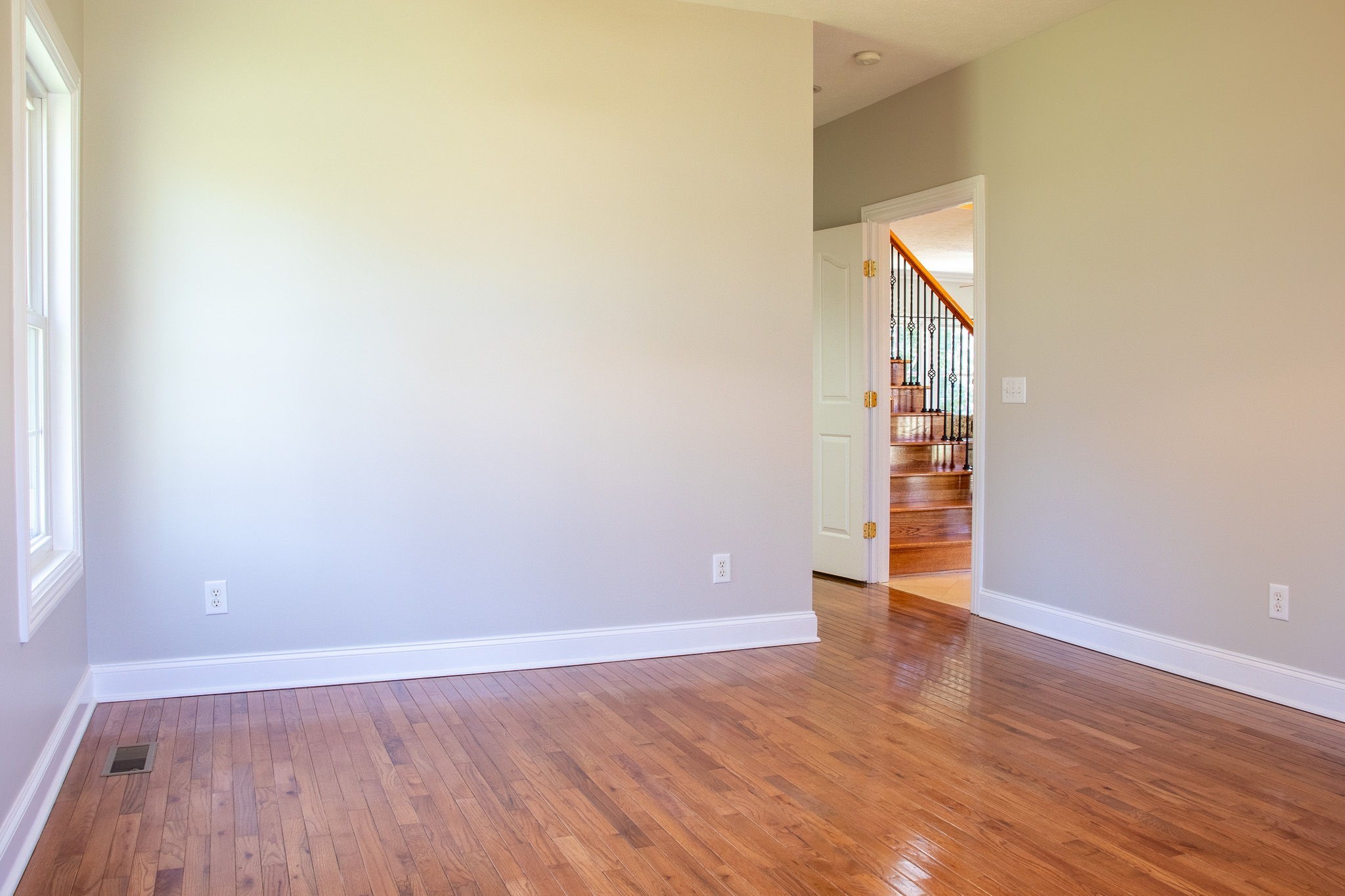 1623 Friendship Road Cross Plains, TN 37049 - Photo 25 of 56 an empty room with wooden floor and windows
