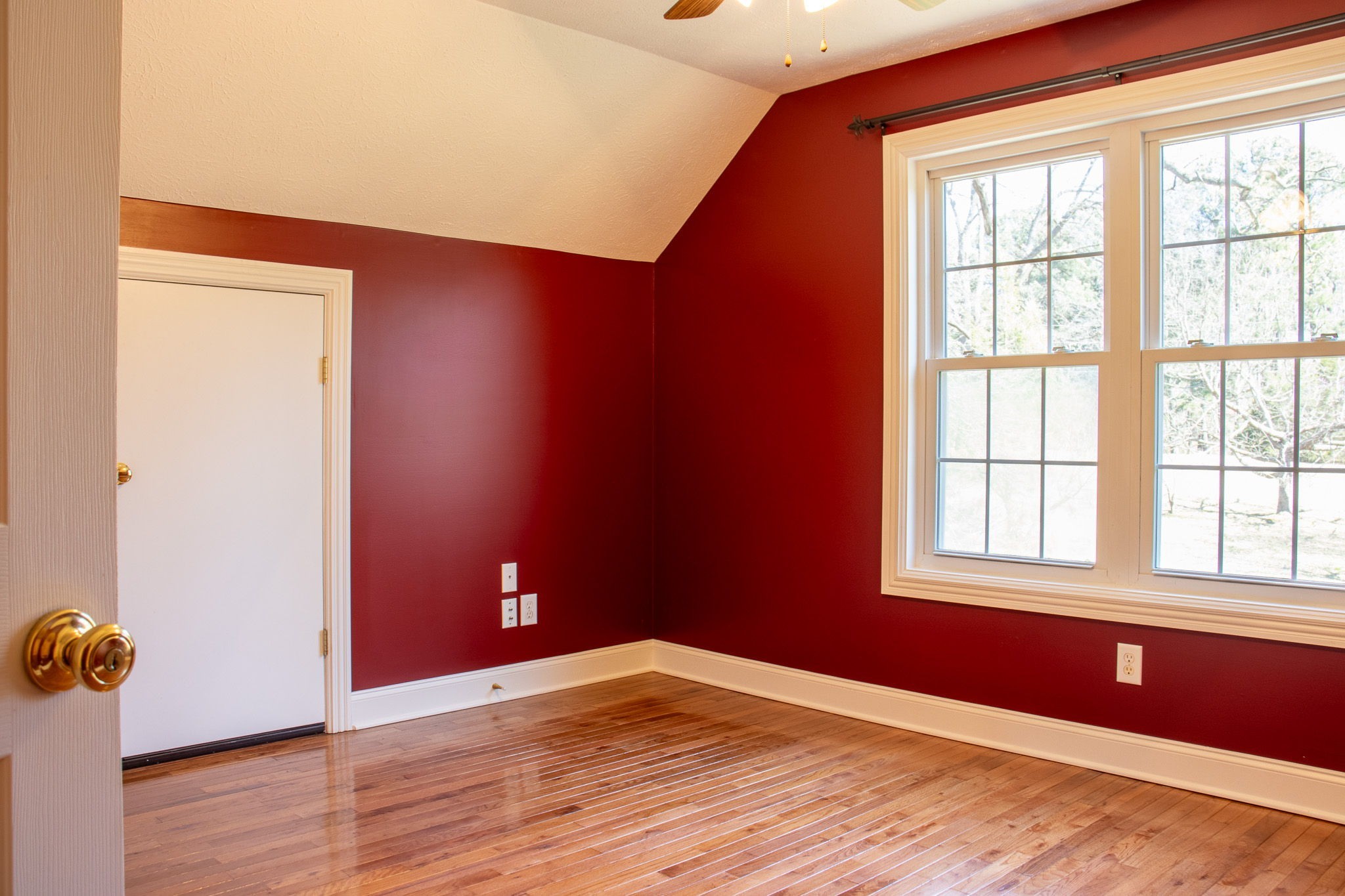 1623 Friendship Road Cross Plains, TN 37049 - Photo 34 of 56 an empty room with wooden floor and windows