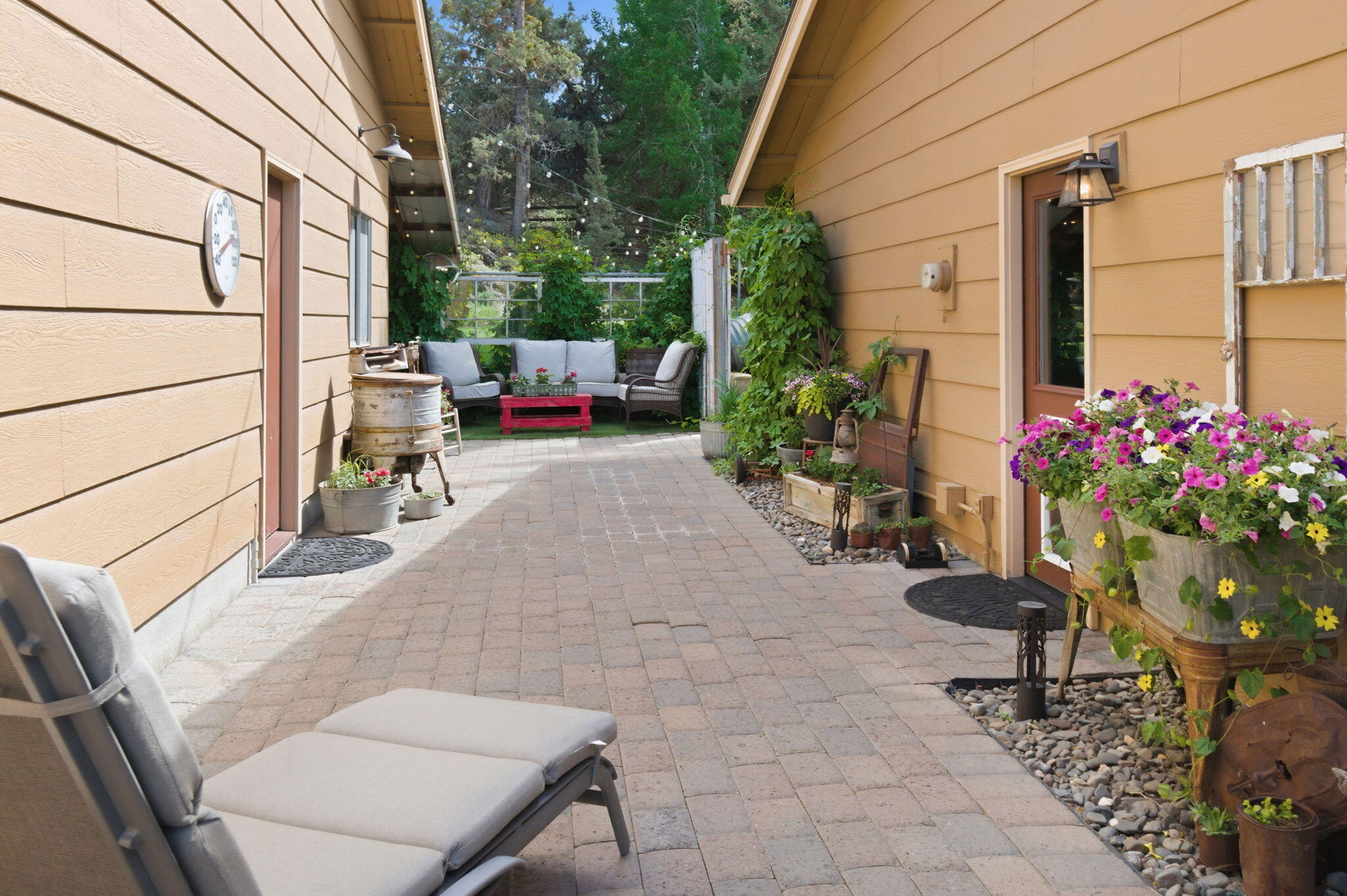 22539 Martee Lane Bend, OR 97701 - Photo 23 of 54 a view of backyard with a table and chairs and potted plants