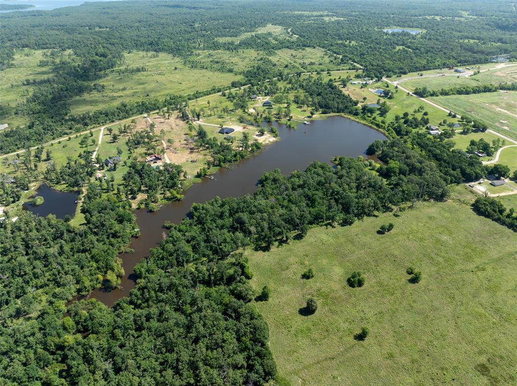 2851 County Road 33900 Powderly, TX 75473 - Photo 1 of 8 an aerial view of residential houses with outdoor space and trees