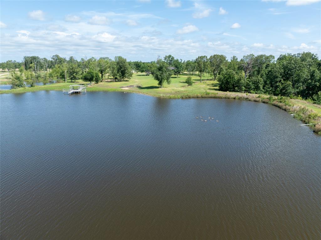 2851 County Road 33900 Powderly, TX 75473 - Photo 2 of 8 a view of a lake with outdoor space