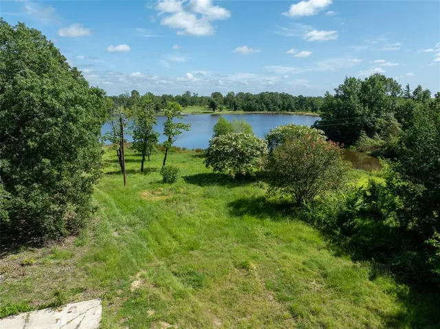a view of lake with green space