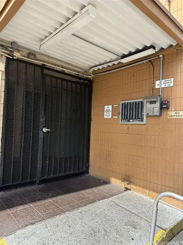 a view of a door and wooden wall