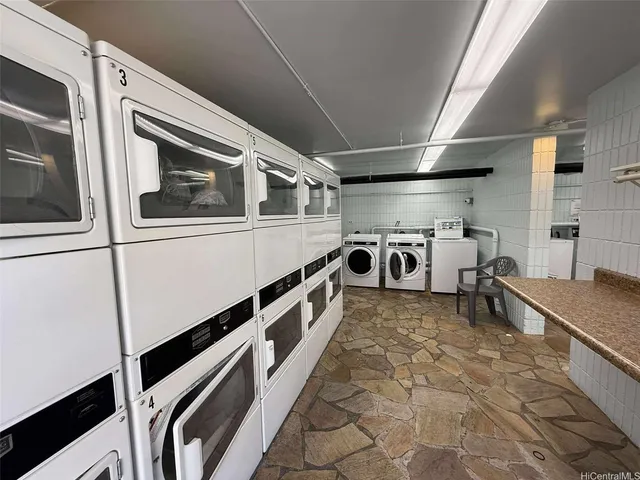 a view of kitchen with refrigerator and window