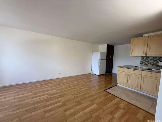 a kitchen with a sink and refrigerator