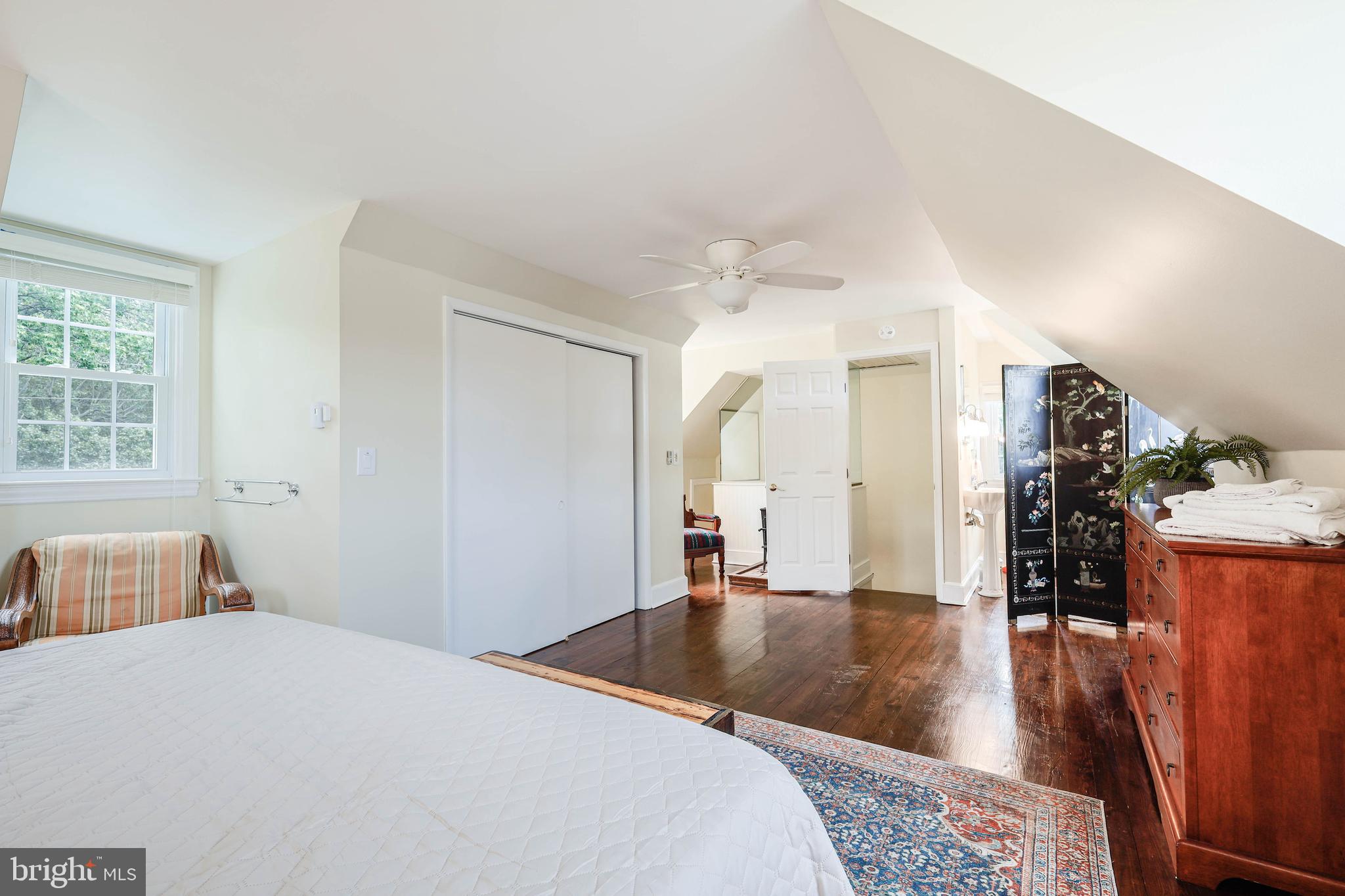 4004 Robinson Neck Road Taylors Island, MD 21669 - Photo 20 of 84 a bedroom with a bed and wooden floor