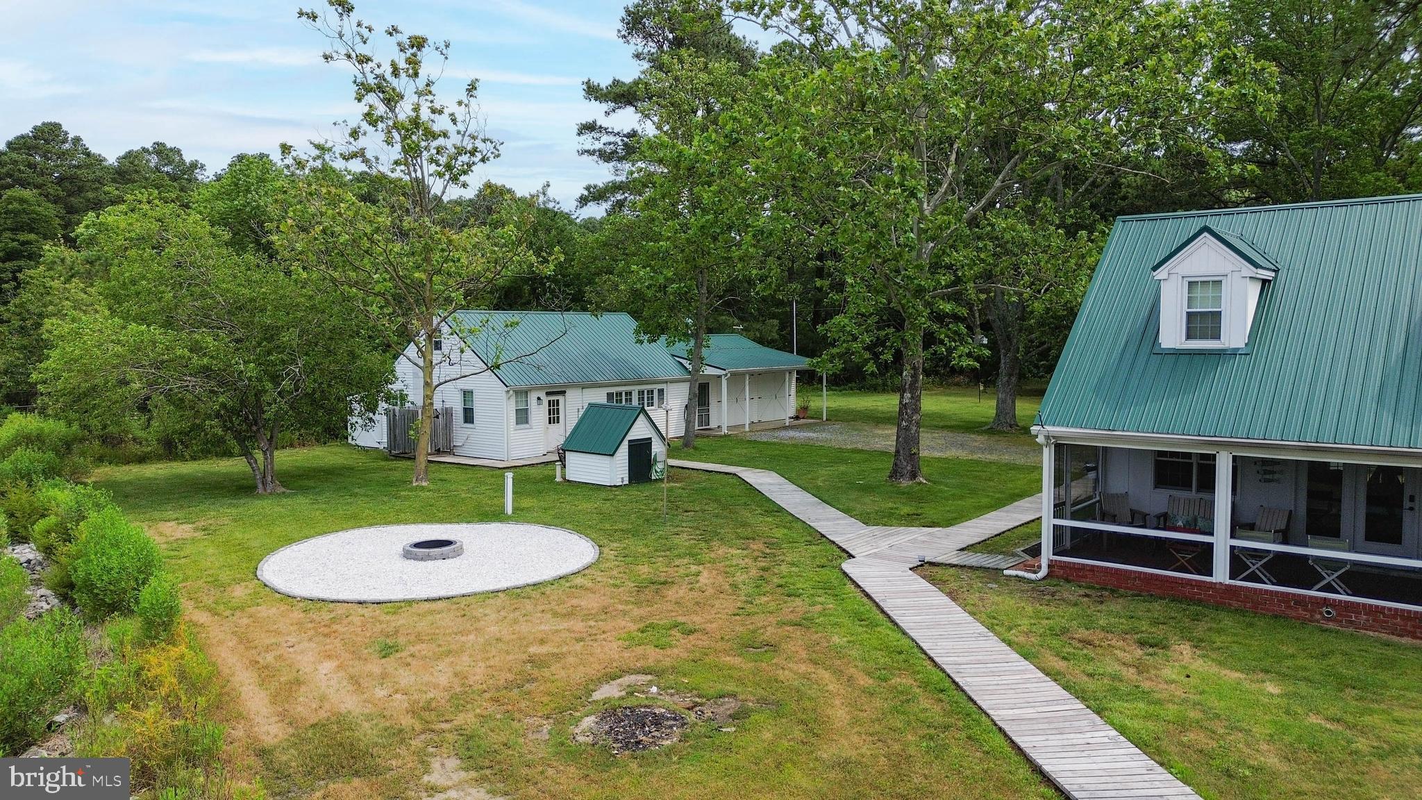 4004 Robinson Neck Road Taylors Island, MD 21669 - Photo 26 of 83 Walkway to bunk house and fire pit