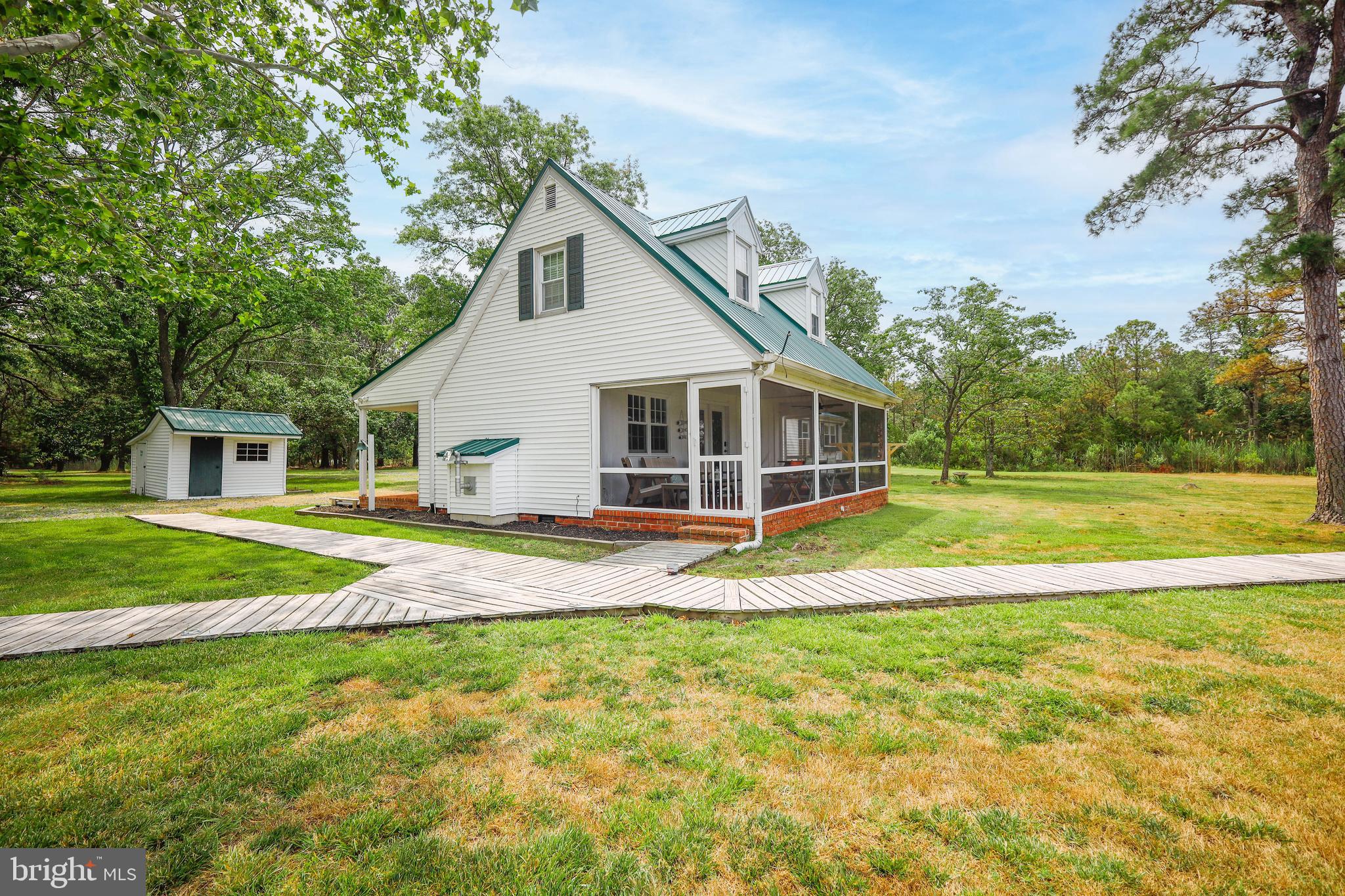 4004 Robinson Neck Road Taylors Island, MD 21669 - Photo 71 of 84 a view of a house with a backyard