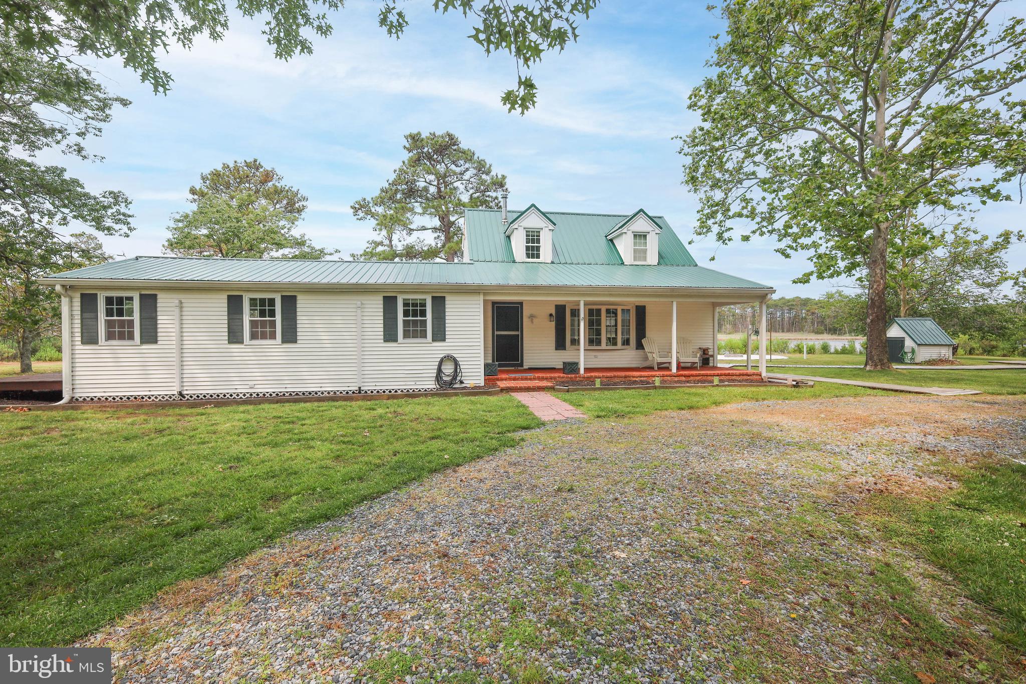 4004 Robinson Neck Road Taylors Island, MD 21669 - Photo 74 of 84 front view of a house with a yard