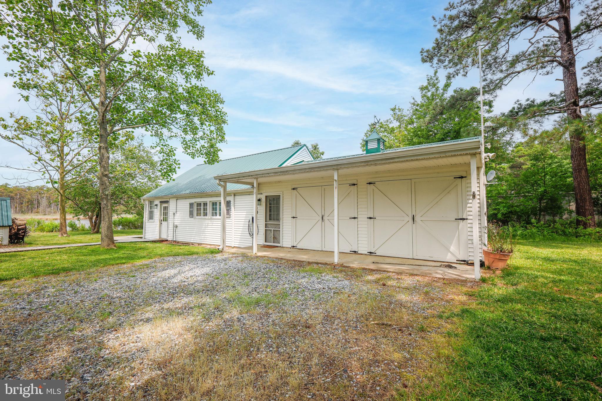 4004 Robinson Neck Road Taylors Island, MD 21669 - Photo 76 of 84 a view of a house with a yard